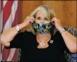  ?? MATT DAHLSEID/New Mexican file photo ?? Gov. Michelle Lujan Grisham removes her mask at the start of a news conference on the state’s COVID-19 response in September. She said Tuesday (Jan. 26) that schools could return to in-person learning if districts so choose beginning Feb. 8.