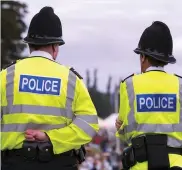  ??  ?? Little and large police officers out on patrol