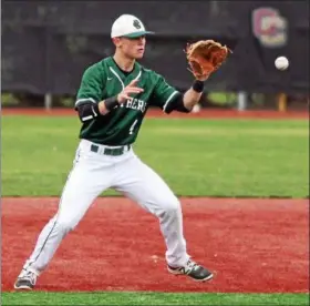  ?? RANDY MEYERS — THE MORNING JOURNAL ?? Elyria Catholic second baseman Ryan Strittmath­er eyes a high grounder.