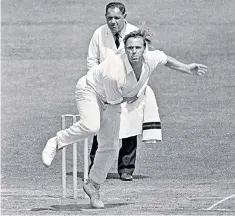  ??  ?? Higgs bowling for Lancashire against Northampto­nshire in 1969 (above); and (back row, second from right) with the England squad which faced Australia at Old Trafford in 1968