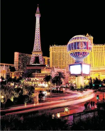 ?? Myung J. Chun / TNS ?? Paris Las Vegas added new lighting to its Eiffel Tower.