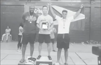  ??  ?? Stephen Fraser (right) finished third in the novice category in the CrossFit Throw Down in Trinidad &amp; Tobago