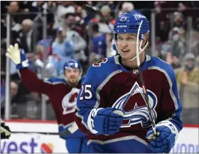  ?? ANDY CROSS — THE DENVER POST ?? Avalanche right wing Logan O’connor celebrates after scoring his first goal in the first period against the Kings on Friday at Ball Arena in Denver.