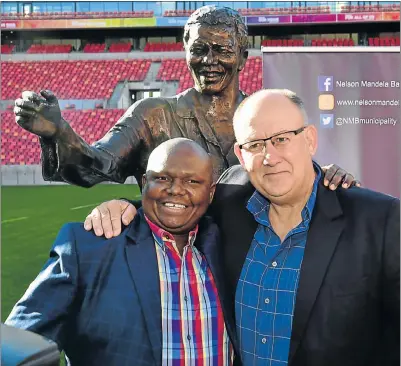  ?? Picture: EUGENE COETZEE ?? BAY BUDDIES: Deputy mayor Mongameli Bobani and mayor Athol Trollip at the Nelson Mandela Bay Stadium with a statue of Madiba used to help commemorat­e Mandela Day yesterday
