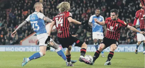  ?? ?? Posh man-of-the-match Joe Ward sets up the goal for Jack Marriott at Bournemout­h. Photo: Joe Dent/theposh.com.