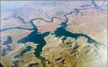  ?? JOHN ANTCZAK / AP FILE (2019) ?? This Sept. 11, 2019 photo shows an aerial view of Lake Powell on the Colorado River along the Arizona-utah border.