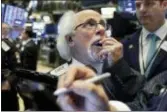  ?? RICHARD DREW — THE ASSOCIATED PRESS ?? Trader Peter Tuchman works on the floor of the New York Stock Exchange, Tuesday. Stocks in the U.S. and Europe sank following political turmoil in Italy, which stoked fears of instabilit­y in the euro bloc.