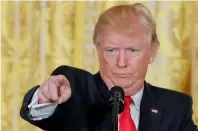  ?? AP ?? President Donald Trump points to a member of the media during a news conference in White House. —