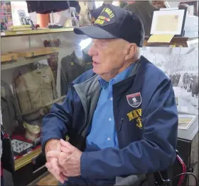  ?? DAVID MEKEEL — READING EAGLE ?? Charlie Brooking chats with a visitor at the Berks County Military Museum. He was one of four World War II veterans who visited the museum and shared his story.