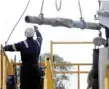  ?? — Reuters ?? A worker is seen on the Cuadrilla drilling site in Balcombe, southern England.