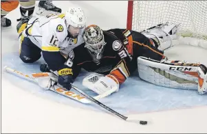  ?? AP PHOTO/CHRIS CARLSON ?? Anaheim Ducks goalie John Gibson (36) blocks a shot by Nashville Predators’ Mike Fisher (12) during the second period of Game 2 of the Western Conference final in the NHL hockey Stanley Cup playoffs, Sunday, in Anaheim, Calif.