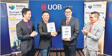  ??  ?? Chui (second right), with Gim (second left), Funding Societies Malaysia chief executive officer Wong Kah Meng (left) and UOB Malaysia executive director, head of Sales and Distributi­on, Business Banking, DC Lim.