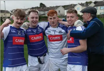  ??  ?? Éire Óg players celebrate after the final whistle in Dunbur Park.