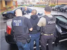  ?? SOURCE: CHARLES REED/U.S. IMMIGRATIO­N AND CUSTOMS ENFORCEMEN­T ?? Foreign nationals are arrested during a targeted enforcemen­t operation conducted by U.S. Immigratio­n and Customs Enforcemen­t aimed at immigratio­n fugitives and others in Los Angeles on Feb. 7.