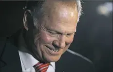  ?? Brynn Anderson/Associated Press ?? Former Alabama Chief Justice and U.S. Senate candidate Roy Moore leaves a church revival Tuesday in Jackson, Ala. He continues to fight allegation­s of impropriet­y with teenage girls.