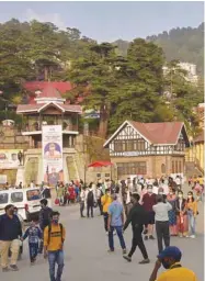  ??  ?? Tourists wander around the ridge area of Shimla in Himachal Pradesh as Indian government warned citizens against complacenc­y as it showed images of people crowding at malls, markets and holidaying in hill stations in northern India.
