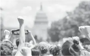  ?? — Gambar Reuters ?? PROTES: Aktivis berarak ke Capitol AS ketika memprotes polisi imigresen oleh pentadbira­n Trump yang menyebabka­n pemisahan keluarga pendatang di Washington, AS kelmarin.