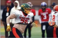  ?? PHOTOS BY BUTCH DILL — THE ASSOCIATED PRESS ?? National offensive lineman Cody Mauch of North Dakota State (70) runs drills during practice for the Senior Bowl NCAA game, Feb. 2, in Mobile, Ala..