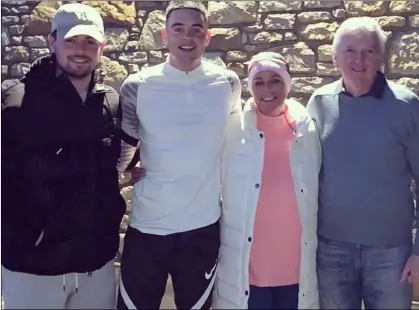  ??  ?? Andrew Keenan (second left) with his mum Patricia, brother Mark, and dad Paschal.