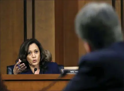  ?? ASSOCIATED PRESS ?? Sen. Kamala Harris, D-Calif., left, questions President Donald Trump’s Supreme Court nominee, Brett Kavanaugh, in the evening of the second day of his Senate Judiciary Committee confirmati­on hearing, Wednesday on Capitol Hill in Washington, to replace retired Justice Anthony Kennedy.