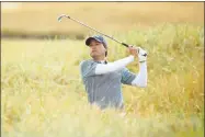  ?? Francois Nel / Getty Images ?? Kevin Kisner plays a shot on the 18th hole during Friday’s second round of the British Open in Carnoustie, Scotland.