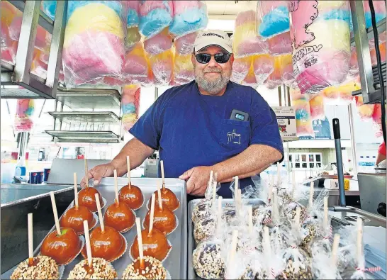  ?? [FRED SQUILLANTE/DISPATCH] ?? Dean Otterbache­r, co-owner of Otterbache­r Bros. Concession­s, and his family have served visitors at the Ohio State Fair for decades. Three of his cousins also operate concession stands at the fair.