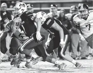  ?? STAFF FILE PHOTO BY ROBIN RUDD ?? Marion County quarterbac­k Logan Walters ran for five touchdowns in Friday’s 55-17 Class 2A semifinal win at Hampton and will lead the Warriors in next Saturday’s final vs. Trezevant.