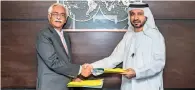  ?? — Supplied photo ?? Rattan Keswani signs the management agreement for Lemon Tree Hotels’ first Dubai property with Mohammed Abdulrazza­q Abdul Aziz Al Mutawa.