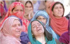  ?? — Reuters ?? Women mourn during the funeral of Murtaza Bashir, a civilian, who according to local media reports was killed during clashes with security forces near the site of a gun battle between suspected fighters and soldiers, during his funeral in Prichoo village in south Kashmir’s Pulwama district.