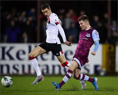  ??  ?? Derek Prendergas­t of Drogheda United in action against Daniel Kelly of Dundalk during the Jim Malone Cup match in Oriel Park.