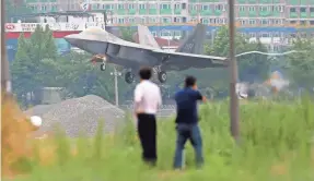  ?? PARK CHUL-HOG/YONHAP VIA AP ?? North Korea says the use of U.S. F-22 Raptor stealth fighter jets in military exercises with South Korea is a threat to peace.