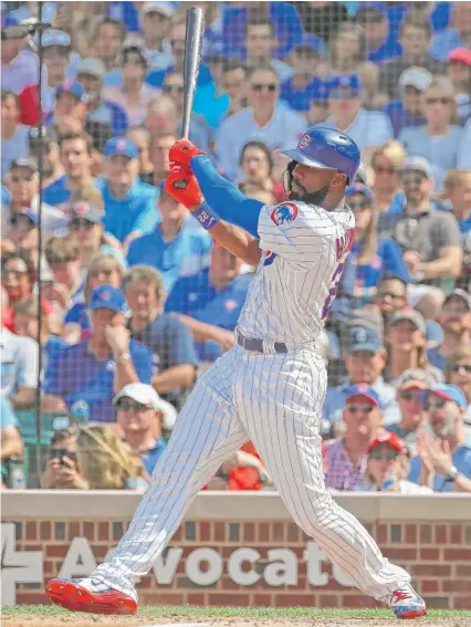  ?? JONATHAN DANIEL/GETTY IMAGES ?? Jason Heyward hits a two-run single to right field to tie the score in the sixth inning against the Nationals.