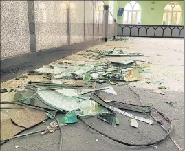  ?? ?? Shattered glasses is seen inside the mosque following a suicide bombing in Kandahar city.
US offers payments to survivors of drone strike