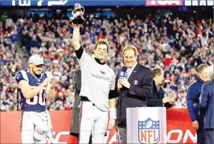  ?? JIM ROGASH/GETTY IMAGES/AFP ?? Star quarterbac­k Tom Brady holds aloft the Lamar Hunt trophy after the New England Patriots won the AFC Championsh­ip Game against the Jacksonvil­le Jaguars at Gillette Stadium on Sunday in Foxborough, Massachuse­tts.