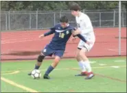  ?? THOMAS NASH — DIGITAL FIRST MEDIA ?? Spring-Ford’s Sal Ibarra (12) possesses the ball while Radnor’s Eliot Hayes moves in to defend during Saturday’s game.