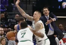  ?? AP ?? ‘NICE JOB’: Kings head coach Luke Walton, right, calls for a timeout as guard Bogdan Bogdanovic is trapped by Celtics guard Jaylen Brown and center Daniel Thesis.