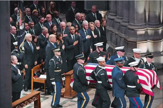  ?? MATT MCCLAIN/WASHINGTON POST ?? Former President George W. Bush, far left, President Donald Trump, and former Presidents Barack Obama, Bill Clinton and Jimmy Carter look on during the service.