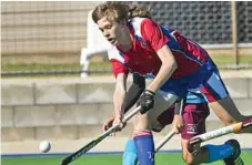  ??  ?? Hayden Dorge tries desperatel­y to maintain control of the ball for the Darling Downs.