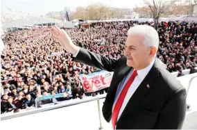  ??  ?? Turkish Prime Minister Binali Yildirim greeting supporters during a public meeting at Ankara Arena on Saturday. (AFP)