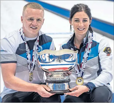  ?? ?? Bobby Lammie and Eve Muirhead with the World Mixed Doubles trophy in Geneva