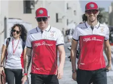  ?? Victor Besa / The National ?? Kimi Raikkonen, left, and Antonio Giovinazzi of Alfa Romeo Racing at Yas Marina on Thursday