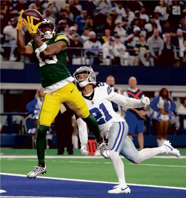  ?? RICHARD RODRIGUEZ/GETTY IMAGES Story, C4 ?? Dontayvion Wicks had a step on the Cowboys’ Stephon Gilmore to haul in a 20-yard TD pass that helped the Packers take a 20-0 lead.