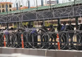  ?? Marco Ugarte / Associated Press ?? People enter the United States at the border station in Laredo, Texas, on July 16. At least 11 people died this year after entering U.S. custody at the border.