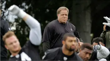  ?? AP PHoTo/Jeff CHIu ?? In this 2016 file photo, Oakland Raiders general manager Reggie McKenzie watches as players stretch during an NFL football rookie minicamp in Alameda, Calif.