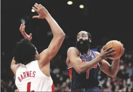  ?? FRANK GUNN/AP ?? Philadelph­ia 76ers guard James Harden (1) drives to the net under pressure from Toronto Raptors forward Scottie Barnes (4) during the second half of Game 6 of an NBA basketball first-round playoff series in Toronto on Thursday.