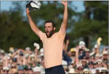  ?? ASHLEY LANDIS — THE ASSOCIATED PRESS ?? Scottie Scheffler celebrates his win at the Masters at Augusta National Golf Club on Sunday in Augusta, Ga.