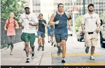  ??  ?? George Looney (second from right) graduated from Back on My Feet but still runs as an alumnus.