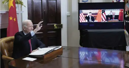  ?? SUSAN WALSH AP ?? President Joe Biden greets Chinese President Xi Jinping in the Roosevelt Room of the White House in Washington on Monday.