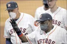  ?? AP photo ?? Astros manager Dusty Baker waves toward the stands after Houston’s 8-2 win over the Seattle Mariners on Friday.