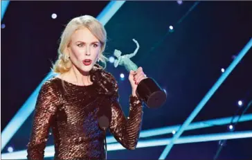  ?? MARK ?? Nicole Kidman accepts the Outstandin­g Performanc­e by a Female Actor in a Television Movie or Limited Series award for during the 24th Annual Screen Actors Guild Awards on Sunday in Los Angeles.